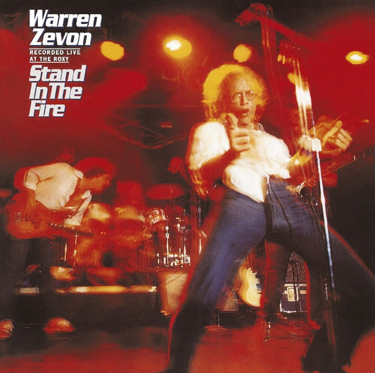 the album cover for Warren Zevon - Stand In The Fire: Recorded Live At The Roxy [LP]