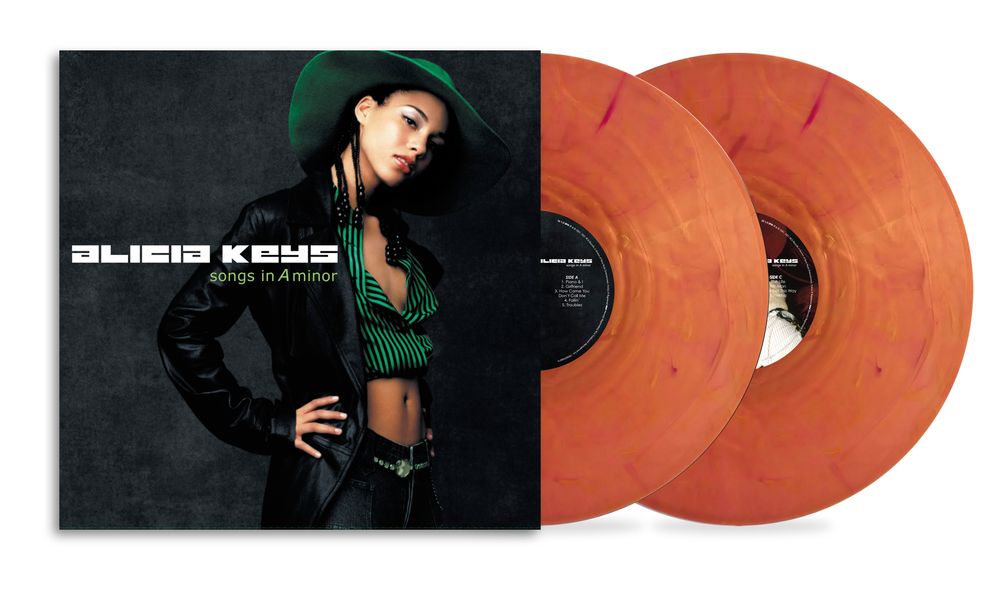 the album cover for Alicia Keys - Songs In A Minor - 25th Anniversary [Translucent Burnt Orange Marbled]